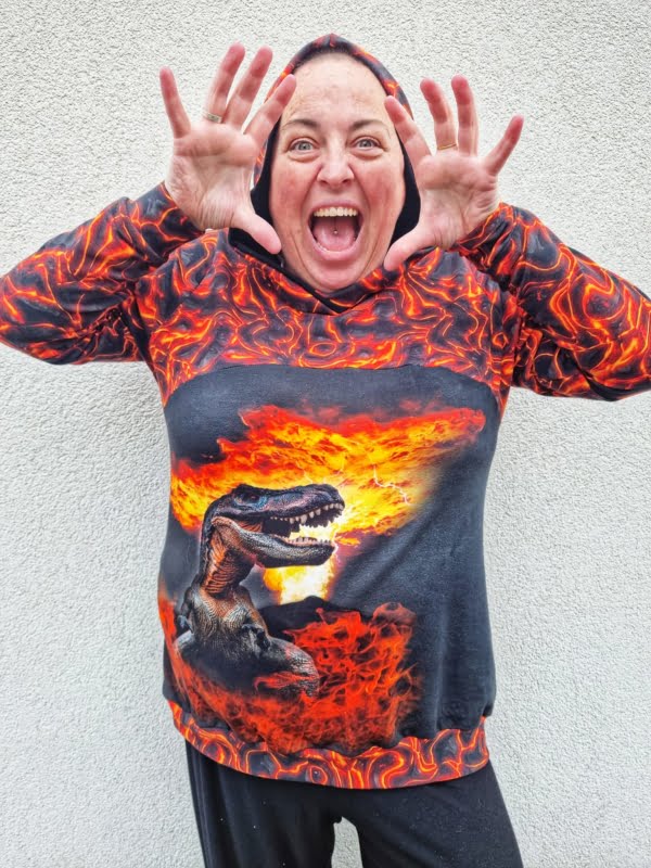 Lava Fire design on stretch looped back frecnh terry cotton lycra fabric for sewing your own clothes. Featuring a fire dinosaur panel too