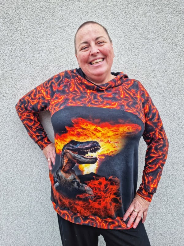 Lava Fire design on stretch looped back frecnh terry cotton lycra fabric for sewing your own clothes. Featuring a fire dinosaur panel too