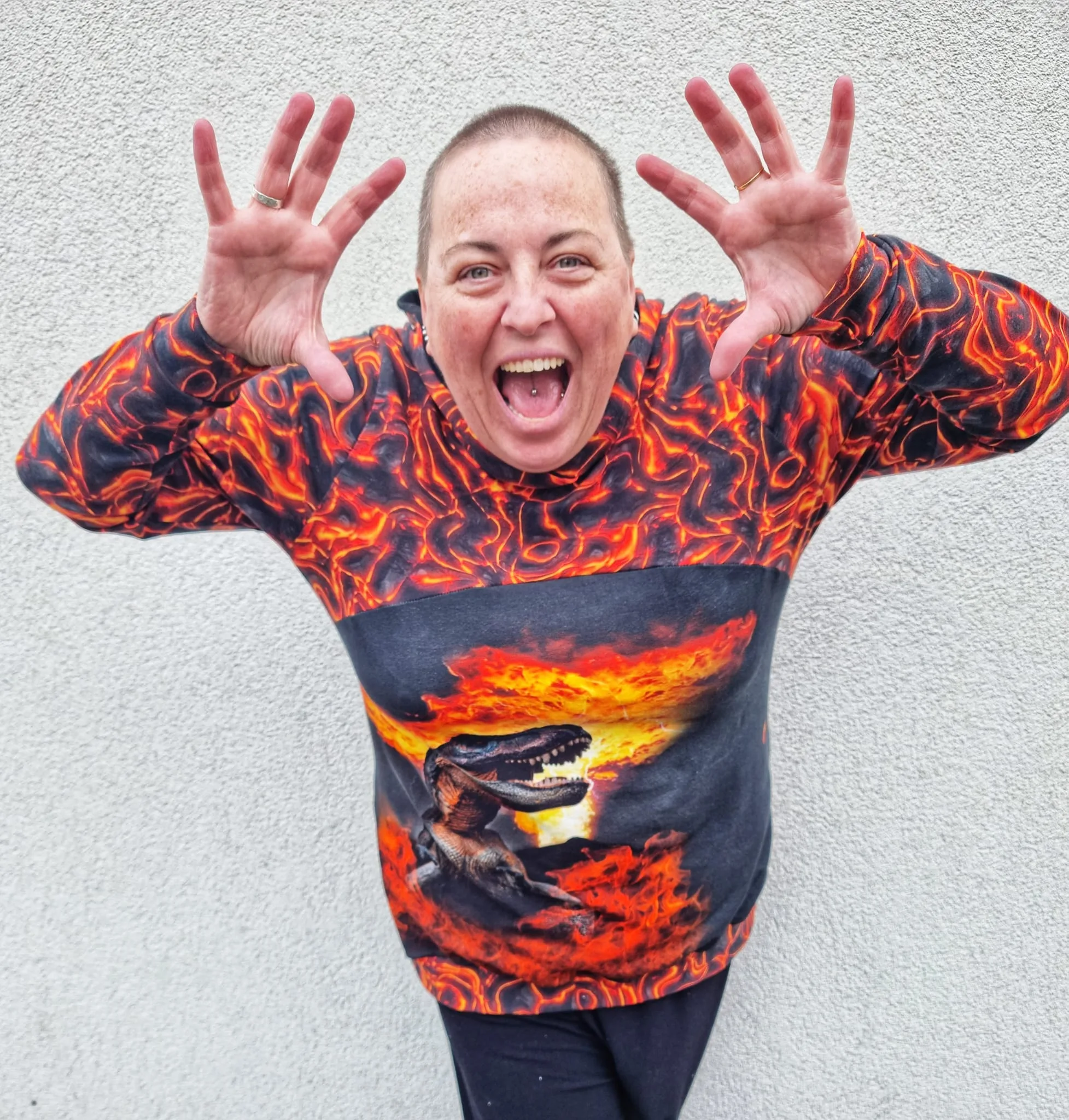 Lava Fire design on stretch looped back frecnh terry cotton lycra fabric for sewing your own clothes. Featuring a fire dinosaur panel too