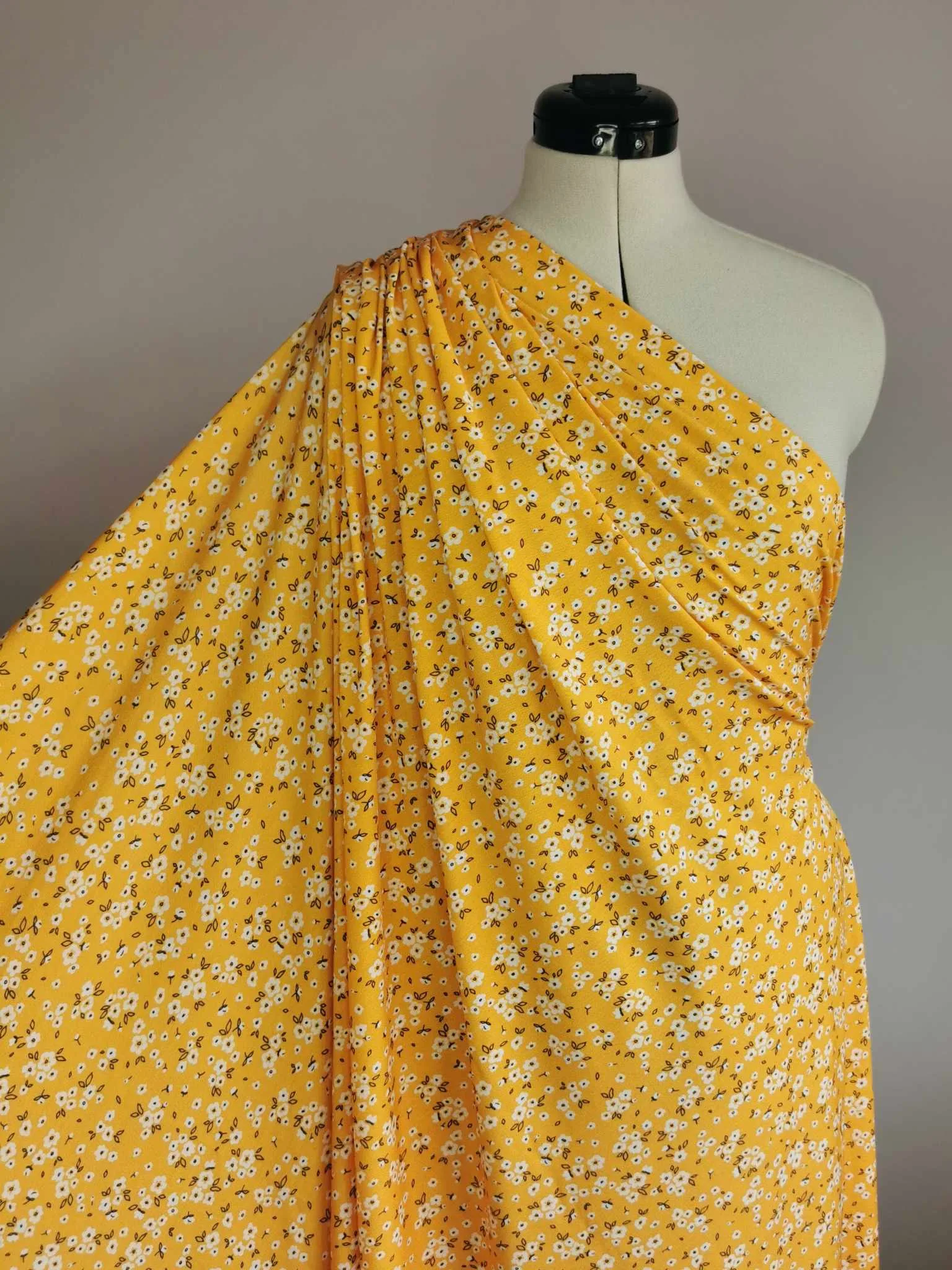 Yellow Ditsy Floral design on stretch super soft bamboo lycra jersey fabric for sewing your own clothes.