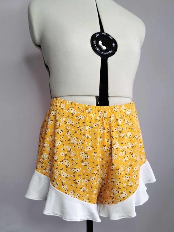 Yellow Ditsy Floral design on stretch super soft bamboo lycra jersey fabric for sewing your own clothes.