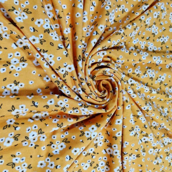 Yellow Ditsy Floral design on stretch super soft bamboo lycra jersey fabric for sewing your own clothes.
