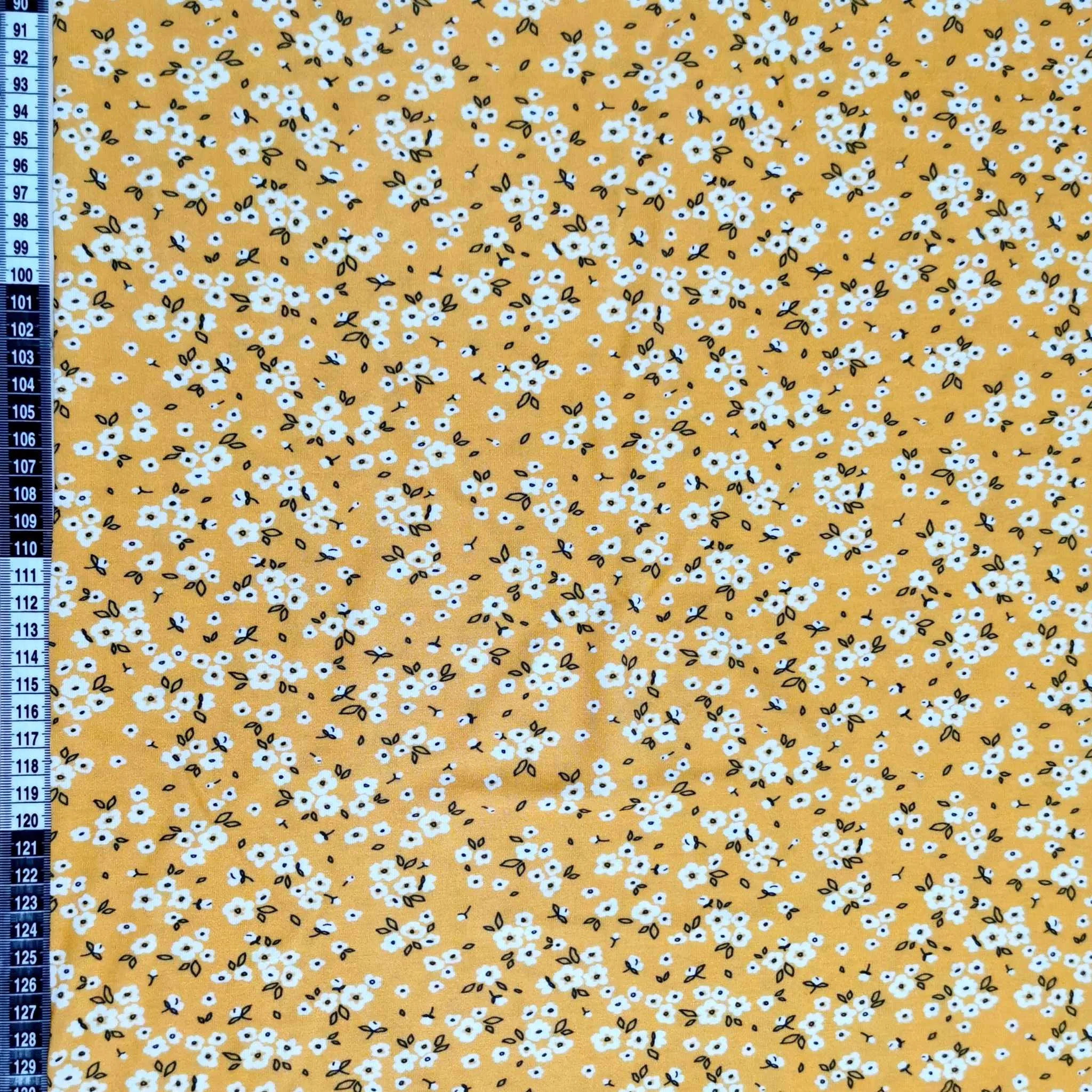 Yellow Ditsy Floral design on stretch super soft bamboo lycra jersey fabric for sewing your own clothes.
