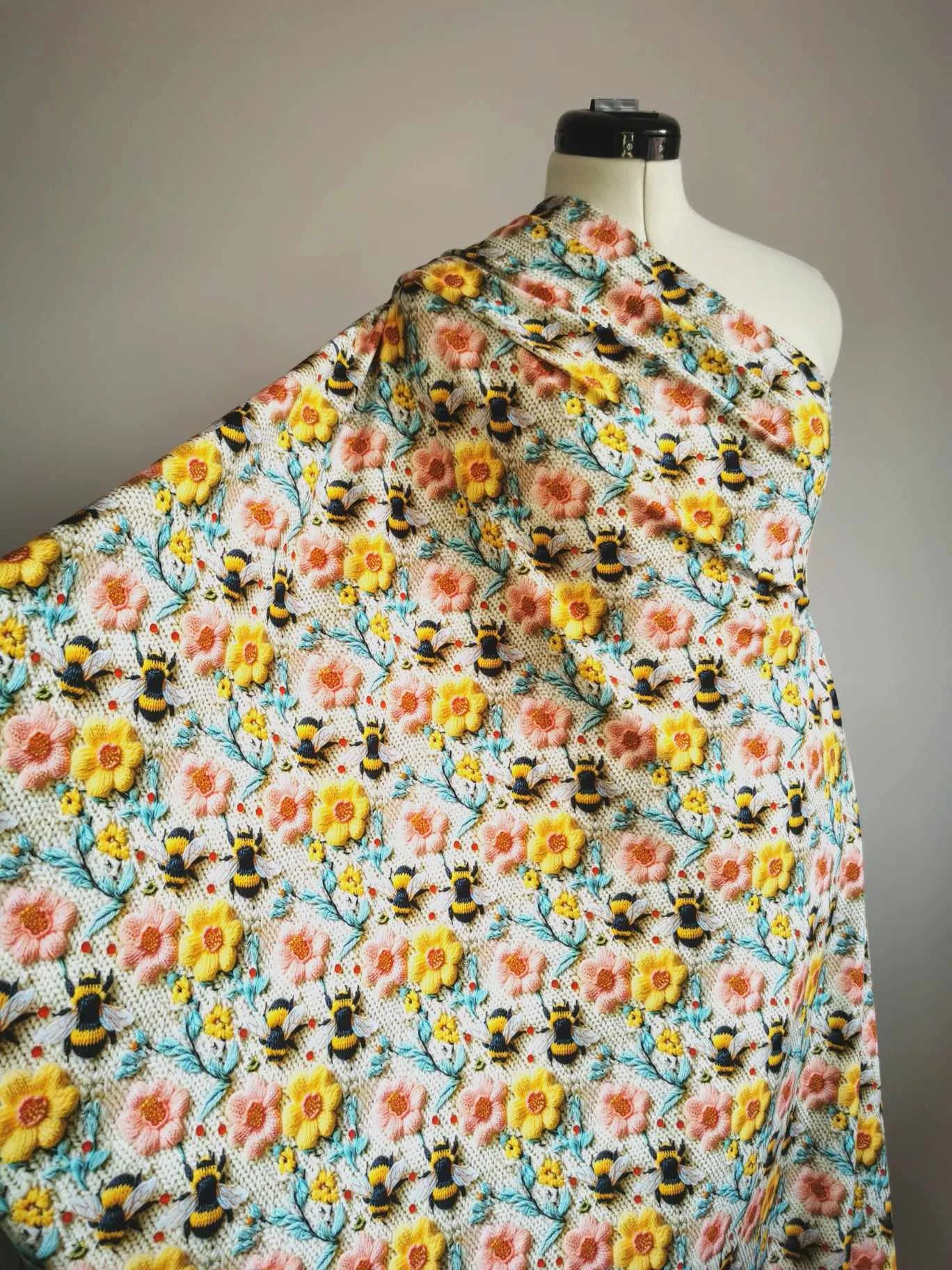 Embroidered effect bee fabric with pink and yellow flowers, four way stretch jersey