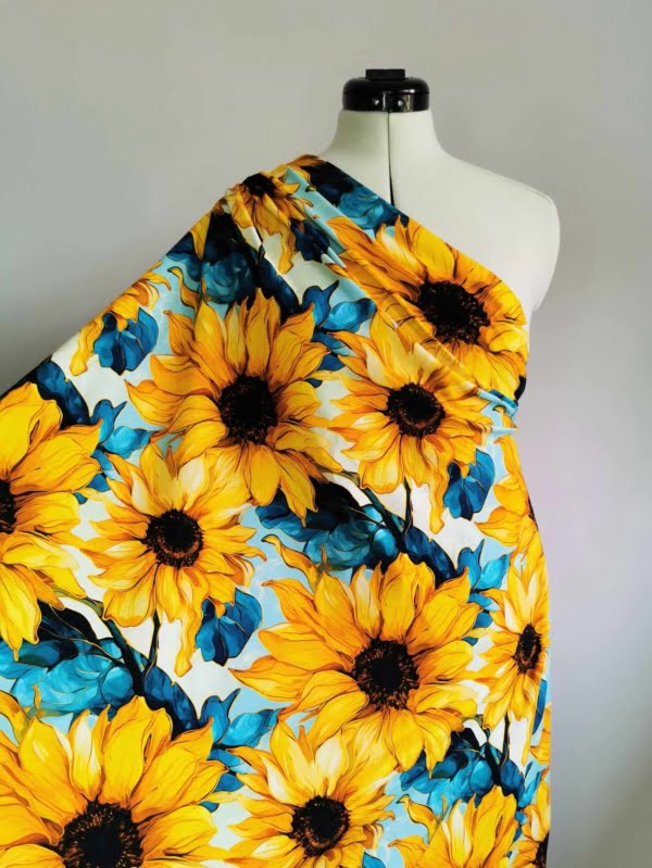 Bright yellow and green sunflower fabric wih gold, on high quality cotton lycra jersey fabric with four way stretch