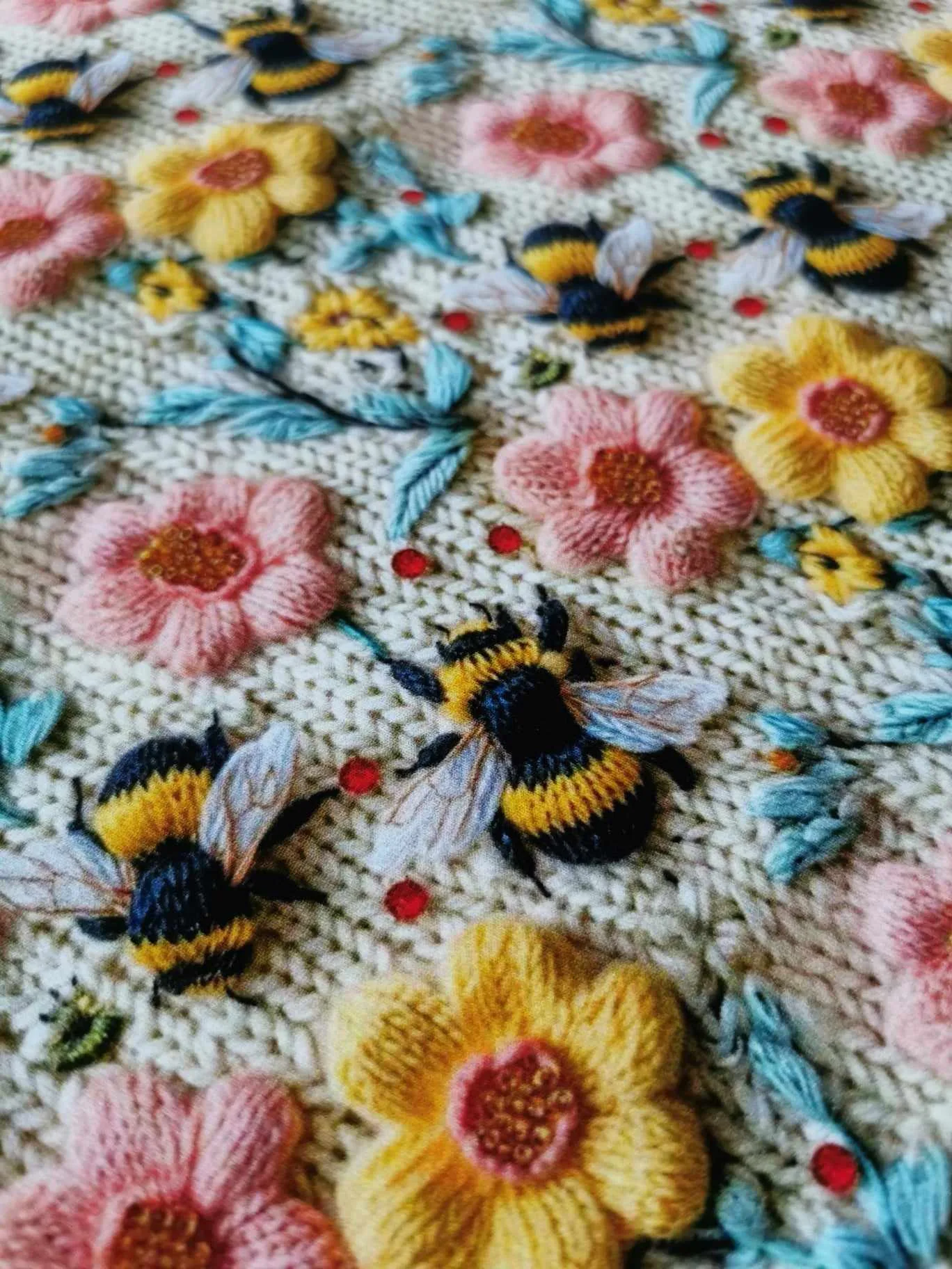 Embroidered effect bee fabric with pink and yellow flowers, four way stretch jersey
