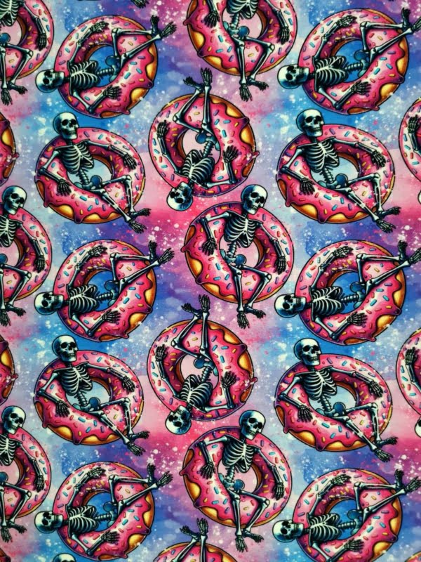 Fun pink skeletons in floating donuts on purple galaxy base, jersey fabric with 4 way stretch