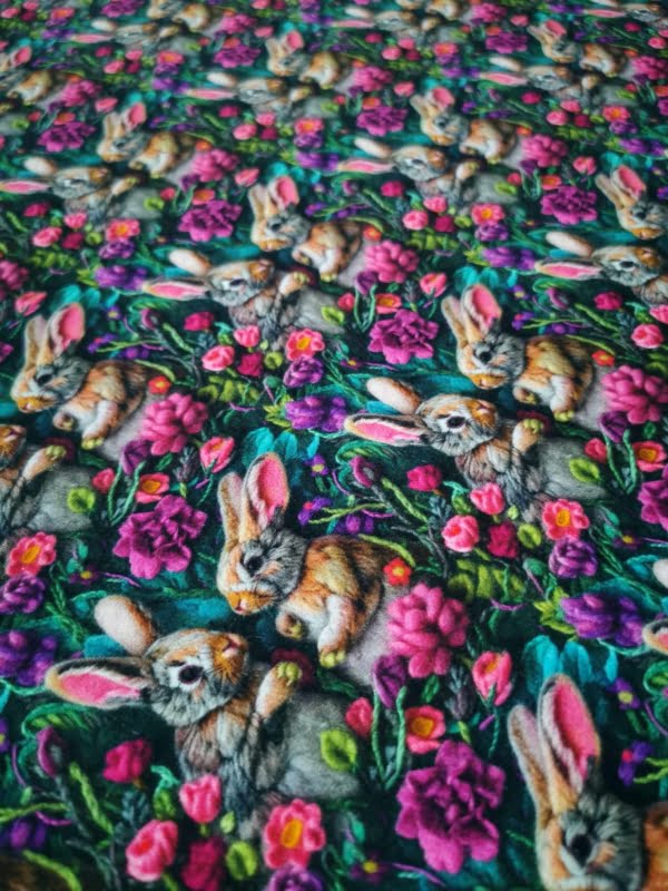 Adorable Bunny rabbits wirh pink and purple flowers. jersey fabric with 4 way stretch