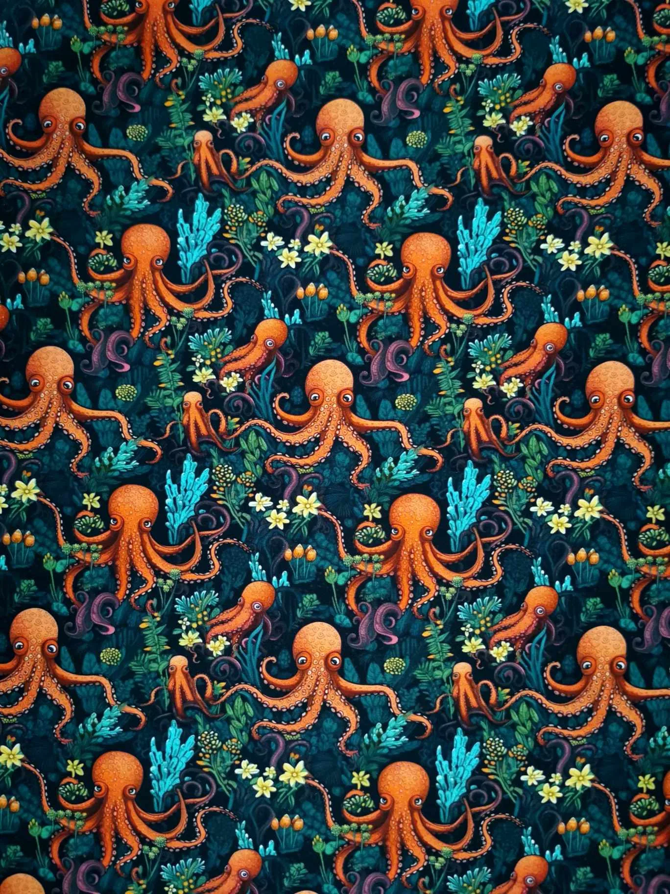 Octopus under the sea design with yellow flowers on a dark blue base. jersey fabric with 4 way stretch