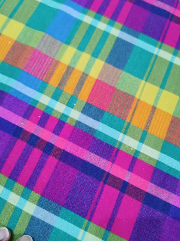 Rainbow Tartan French Terry with small white dot flaws throughout length