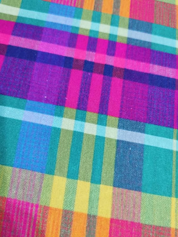 Rainbow Tartan French Terry with small white dot flaws throughout length