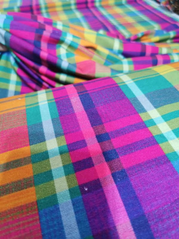 Rainbow Tartan French Terry with small white dot flaws throughout length