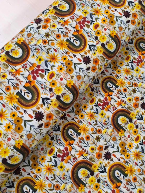 Cute autumb colours in this boho rainbow deisgn, which has been digitally printed on Stretch Cotton Jersey Fabric