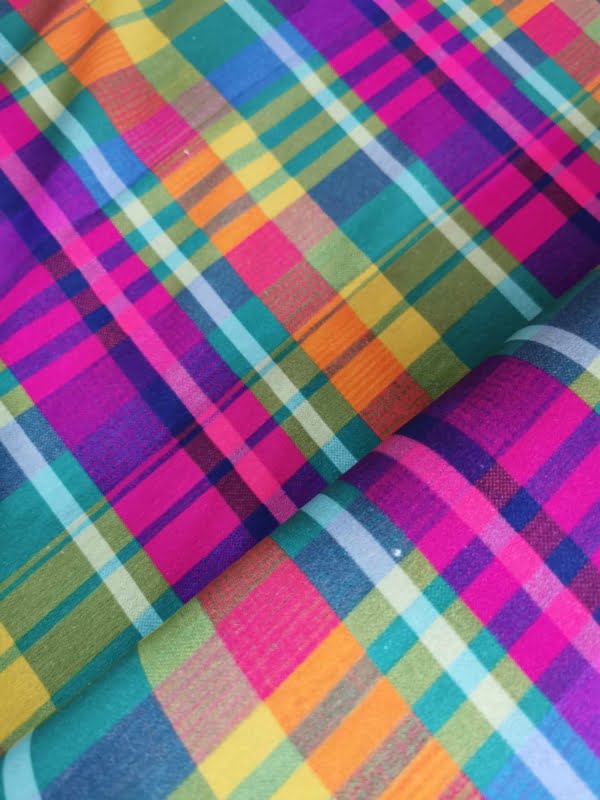 Rainbow Tartan French Terry with small white dot flaws throughout length