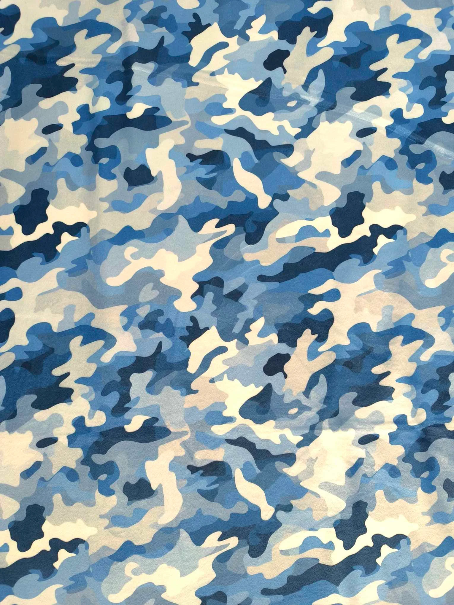 Blue Camouflage design on super soft squish fabric, a stretchy snuggly polyester material.