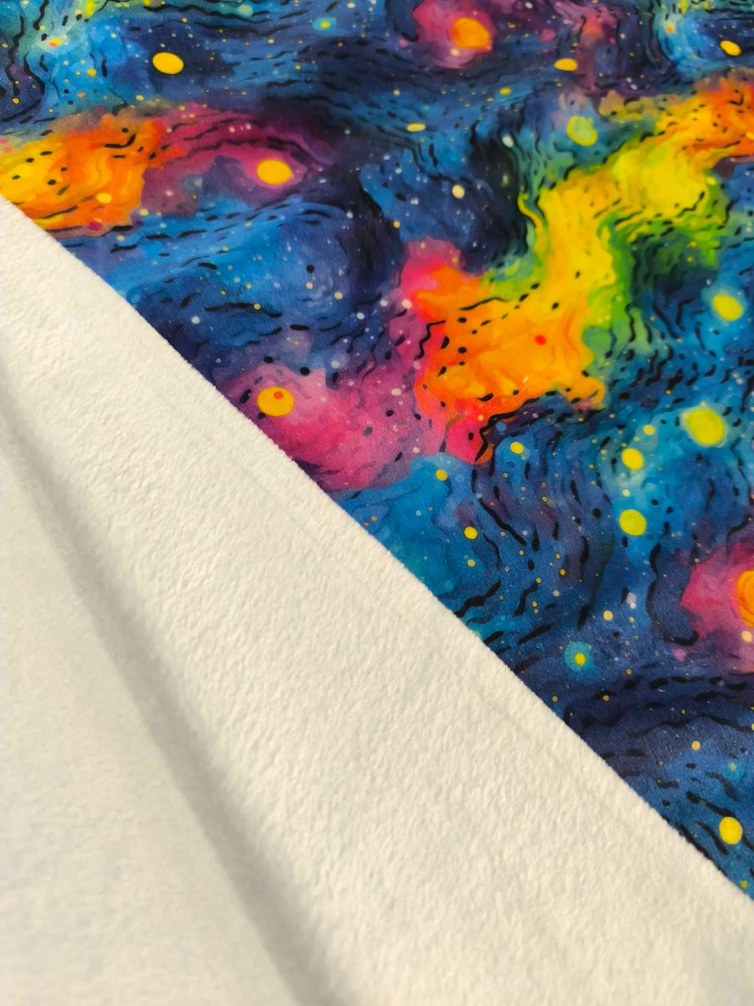 vibrant rainbow Gakaxy design on super soft squish fabric, a stretchy snuggly polyester material.