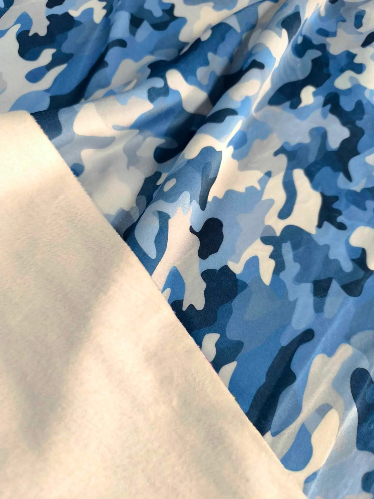 Blue Camouflage design on super soft squish fabric, a stretchy snuggly polyester material.