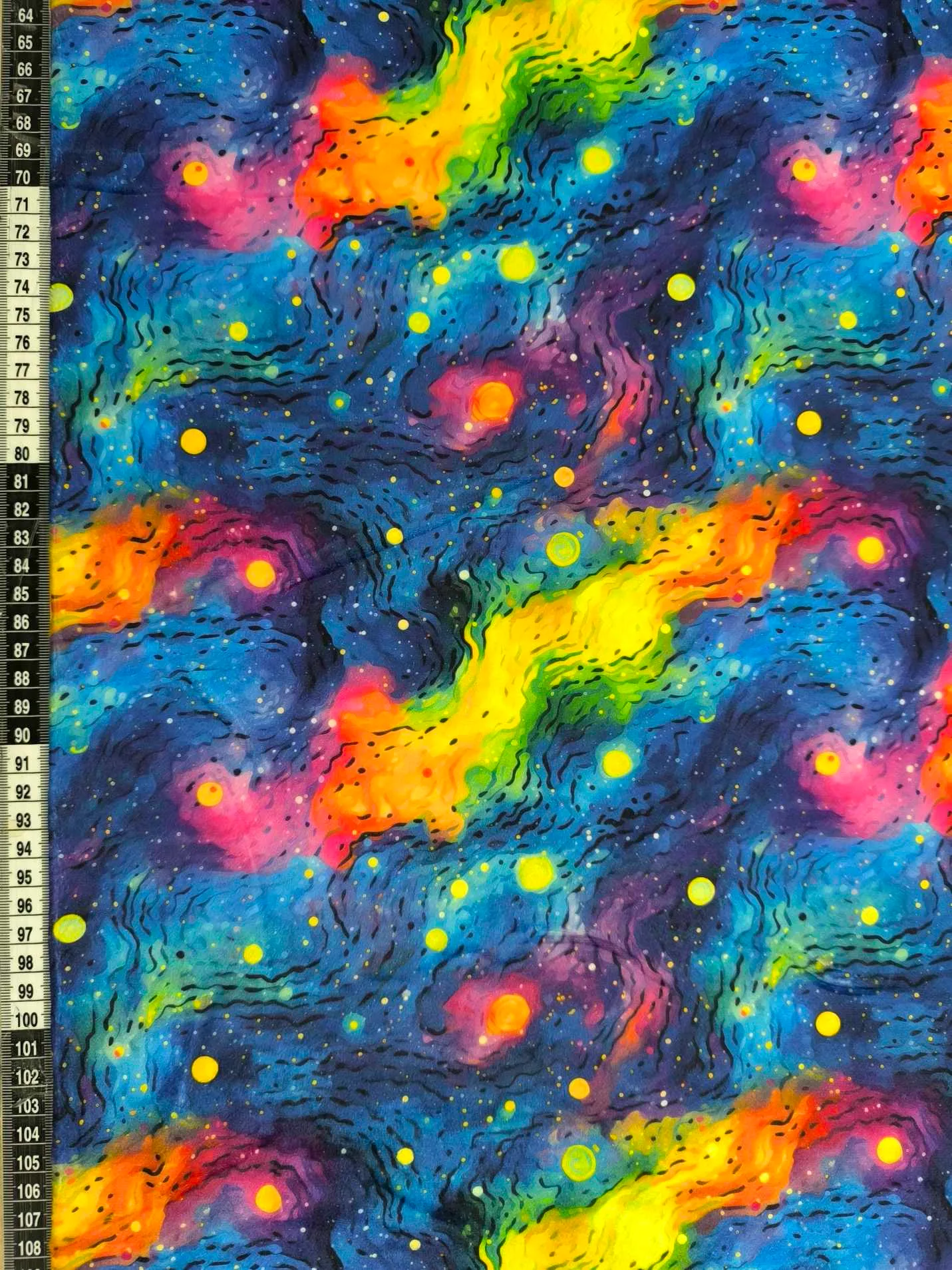 vibrant rainbow Gakaxy design on super soft squish fabric, a stretchy snuggly polyester material.