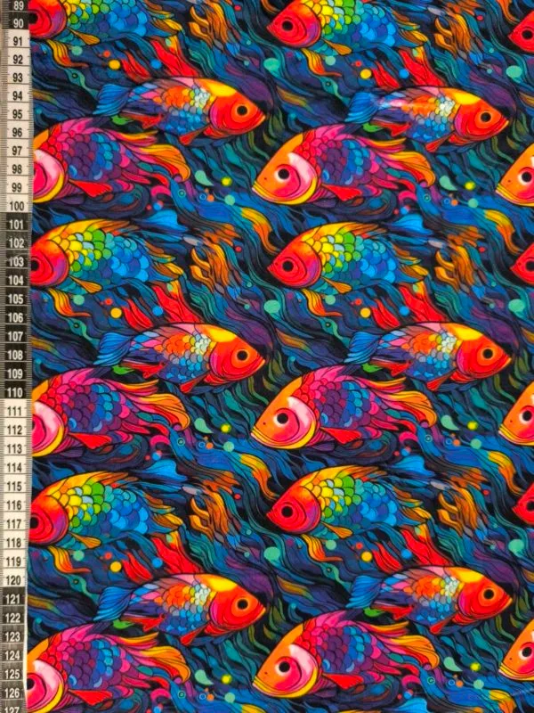 vibrant rainbow Fish design on super soft squish fabric, a stretchy snuggly polyester material.