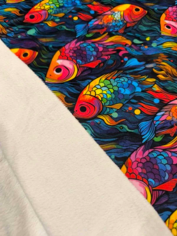 vibrant rainbow Fish design on super soft squish fabric, a stretchy snuggly polyester material.