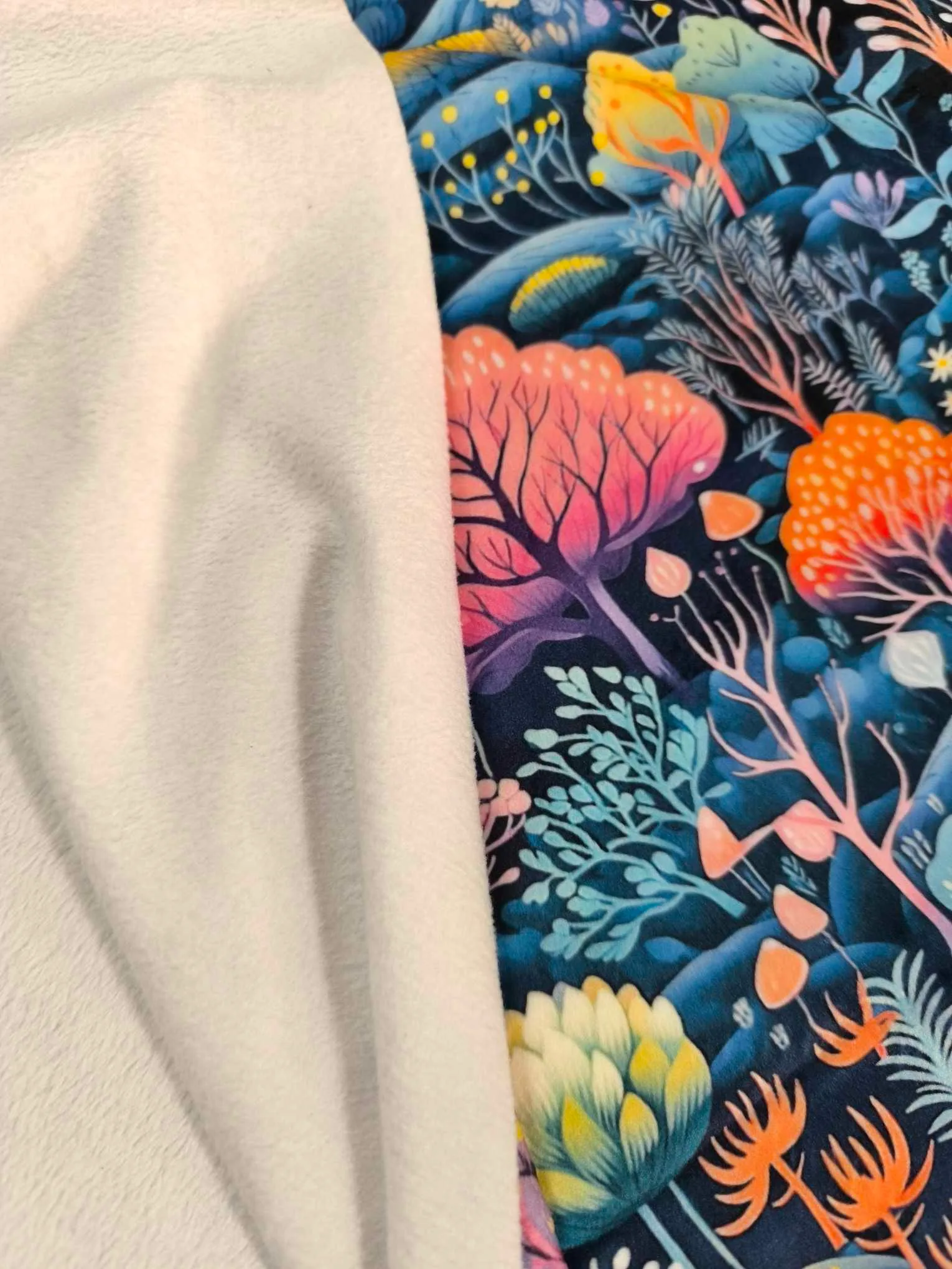 Pastel forest design on super soft squish fabric, a stretchy snuggly polyester material.