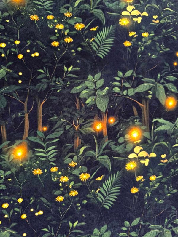 Firefly forest featuring green trees on a black background with flashes of warm orange lights on beautiful quality stretch jersey fabric, perfect for sewing your own clothes.