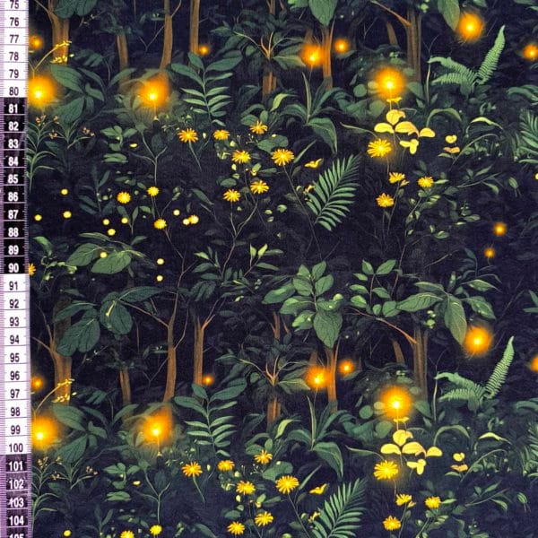 Firefly forest featuring green trees on a black background with flashes of warm orange lights on beautiful quality stretch jersey fabric, perfect for sewing your own clothes.