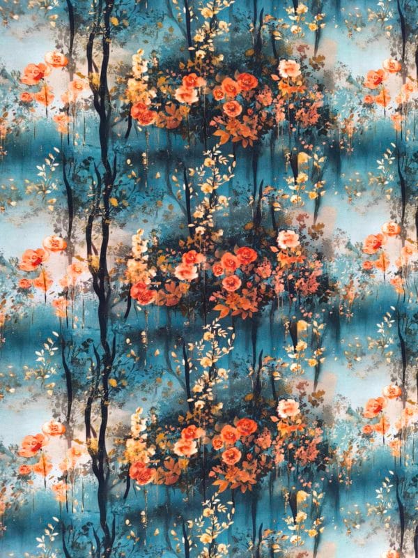 Beautiful floral design with orange and gold flowers, with blue and white clouds merging in the bakcground on beautiful quality stretch jersey fabric, perfect for sewing your own clothes.