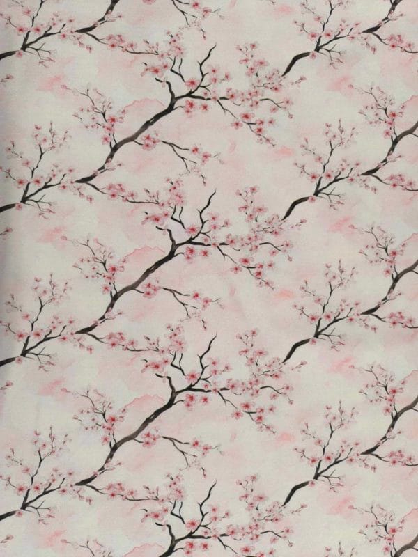 Cherry blossom on a Delicate pink watercolour background on beautiful quality stretch jersey fabric, perfect for sewing your own clothes.