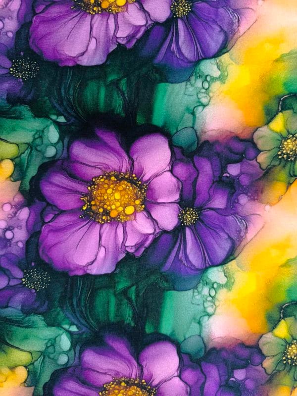 floral alcohol ink style design with purple and green flowers with flashes of yellow on beautiful quality stretch jersey fabric, perfect for sewing your own clothes.