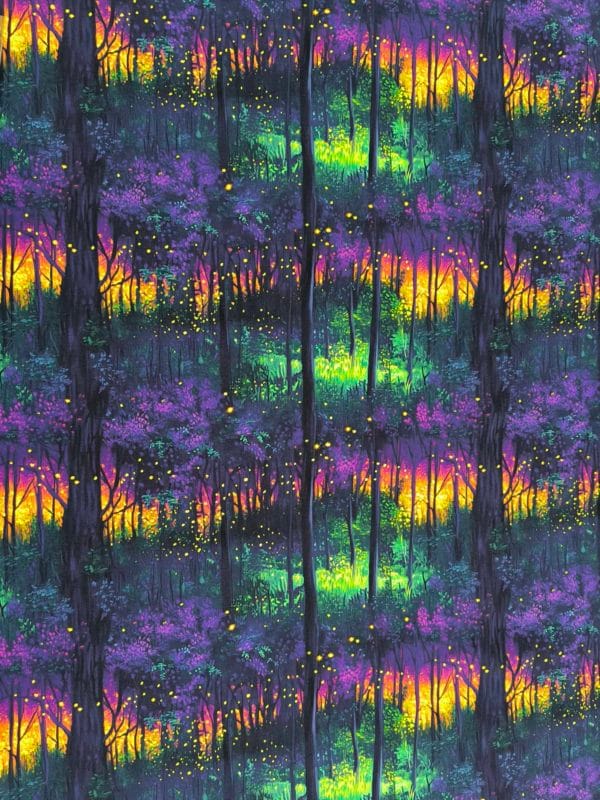 vibrant sunset colours in a deep dark woodland, flashes of yellow pink purple and blue on beautiful quality stretch jersey fabric, perfect for sewing your own clothes.