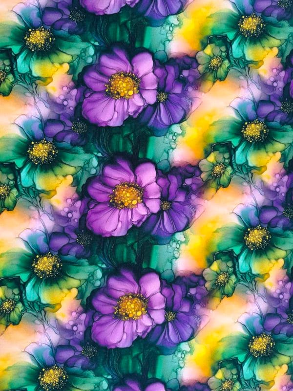 floral alcohol ink style design with purple and green flowers with flashes of yellow on beautiful quality stretch jersey fabric, perfect for sewing your own clothes.