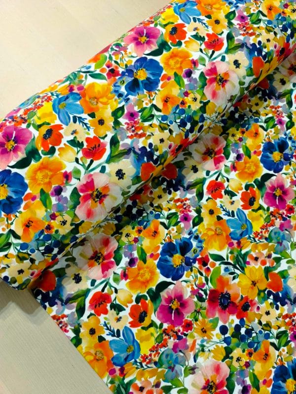Colourful petals and florals on Jersey stretch fabric base, beautifully soft and stretchy material.