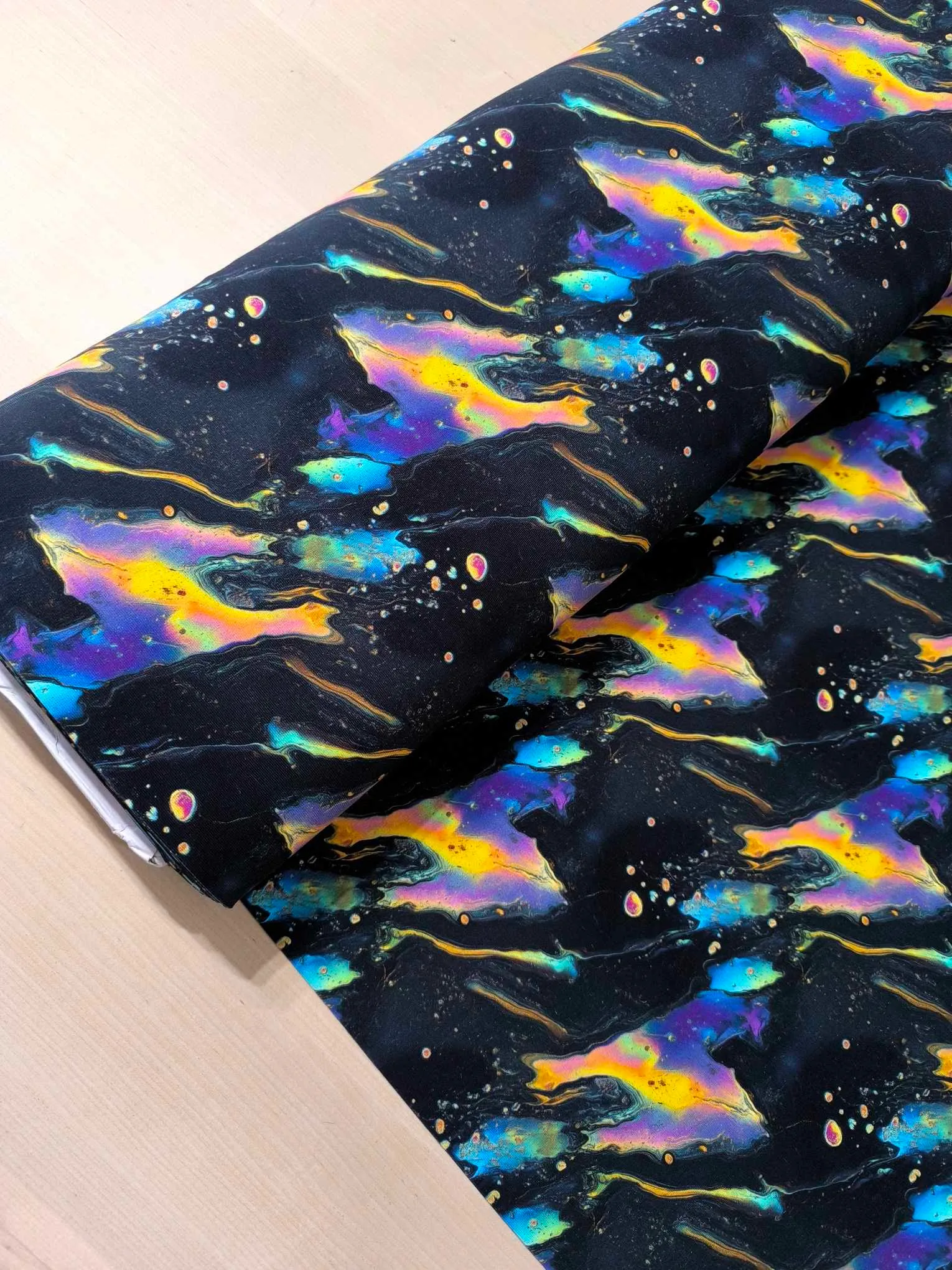Black oil slick design on a jersey stretch fabric base, beautifully soft and stretchy material.