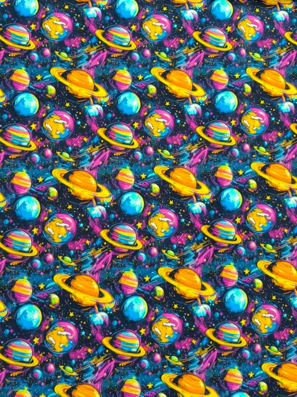 Funky cool planet designs on a dark blue background with purple elements. Jersey stretch fabric base, beautifully soft and stretchy material.