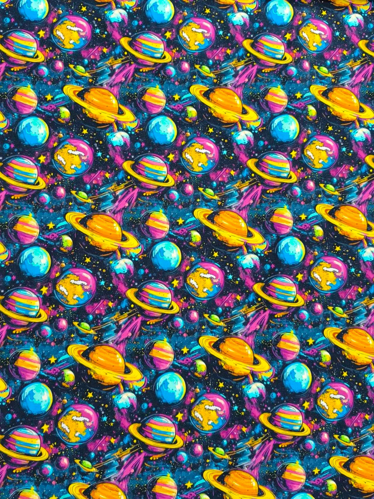 Funky cool planet designs on a dark blue background with purple elements. Jersey stretch fabric base, beautifully soft and stretchy material.