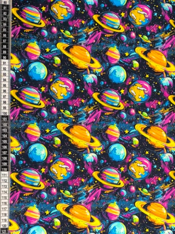 Funky cool planet designs on a dark blue background with purple elements. Jersey stretch fabric base, beautifully soft and stretchy material.