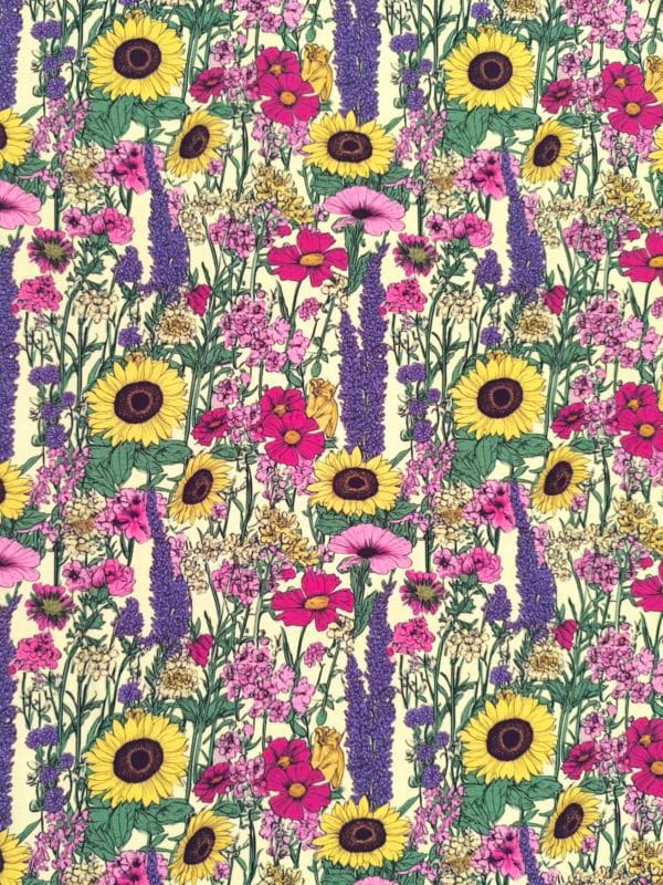 Sunflower and lavendar flowers on a pretty pale yellow base. Jersey stretch fabric base, beautifully soft and stretchy material.