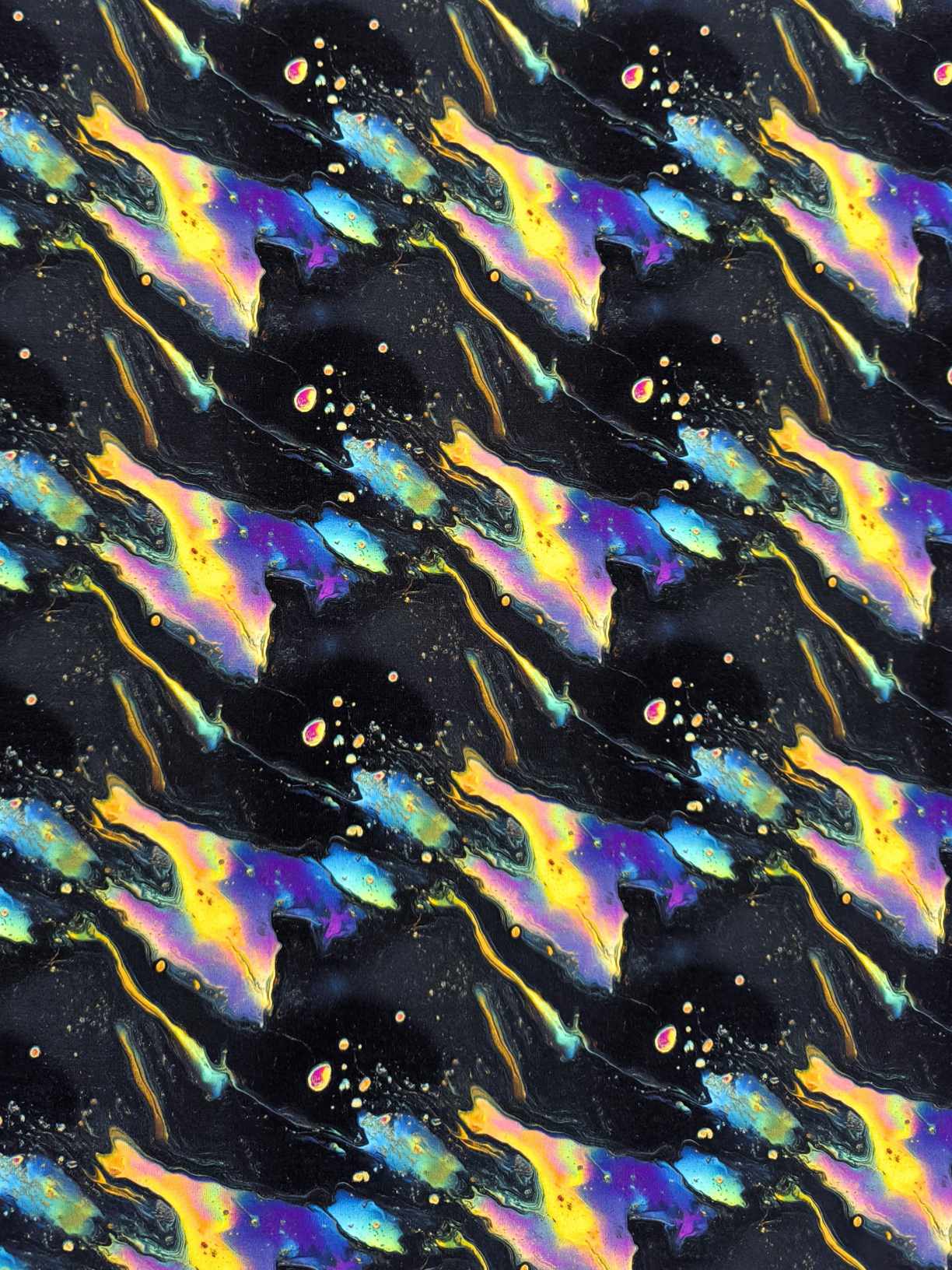 Black oil slick design on a jersey stretch fabric base, beautifully soft and stretchy material.
