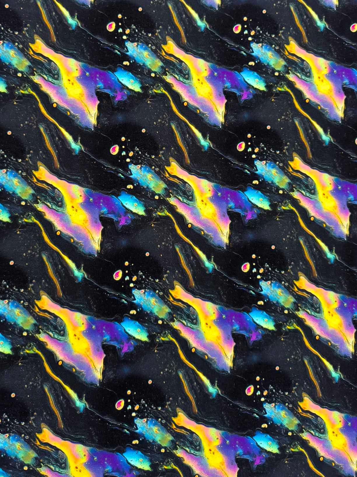 Black oil slick design on a jersey stretch fabric base, beautifully soft and stretchy material.