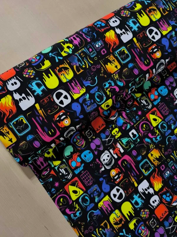 Super cool square design. with graffiti style art in each square, on a black background. Jersey stretch fabric base, beautifully soft and stretchy material.